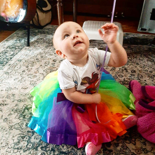baby girl in a 'que-tee'